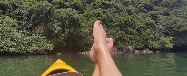 Canoe inside Sumidero canyon river. Vietnam halong bay and tourist feet enjoy vacation concept