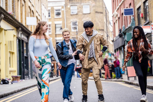 istock Young friends mucking about having fun together 1796732587