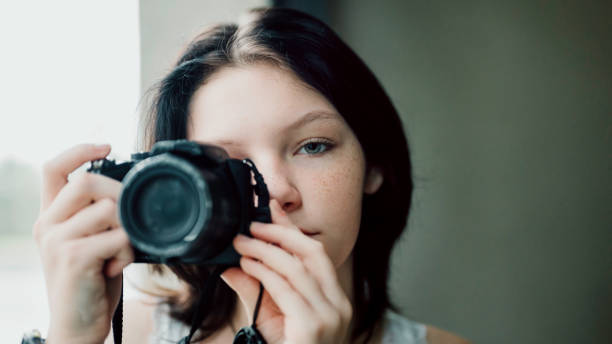 istock Transgender non-binary teenager with a camera, hobby photographer 1796751821