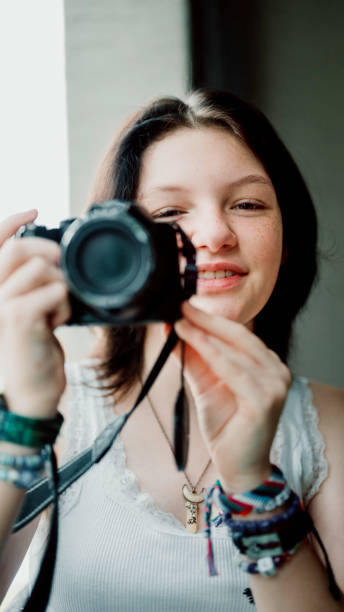 istock Transgender non-binary teenager with a camera, hobby photographer 1796751822