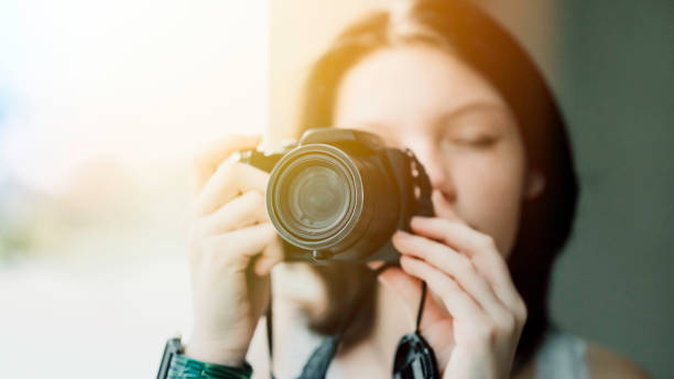 istock Transgender non-binary teenager with a camera, hobby photographer 1796751826