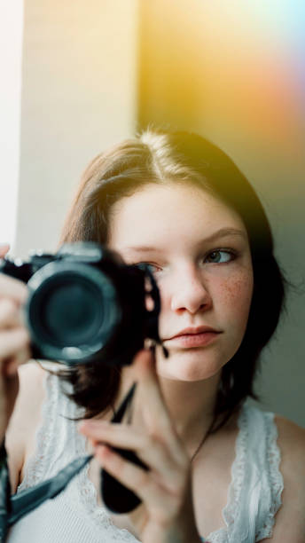 istock Transgender non-binary teenager with a camera, hobby photographer 1796756552