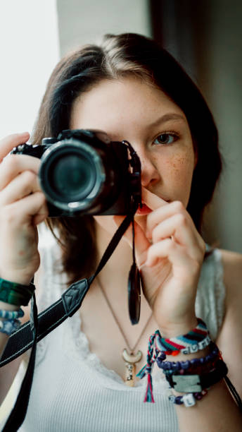 istock Transgender non-binary teenager with a camera, hobby photographer 1796759766