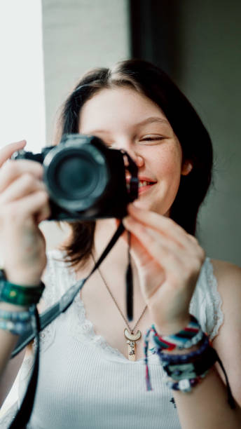 istock Transgender non-binary teenager with a camera, hobby photographer 1796759772