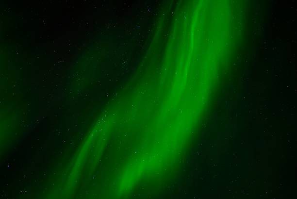 istock Dramatic night sky featuring deep emerald green Northern Lights in Tromso, Norway 1796764737