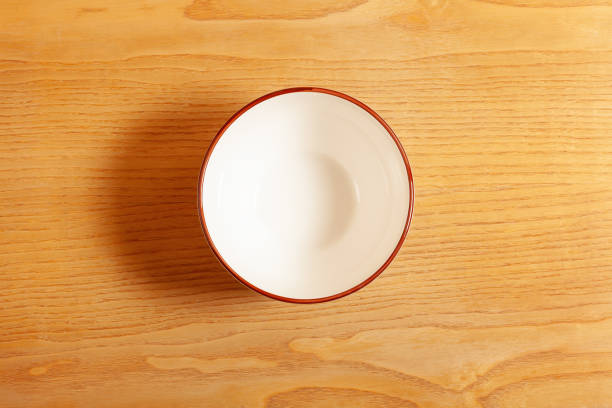 istock Empty white bowl on wooden background 1796768522