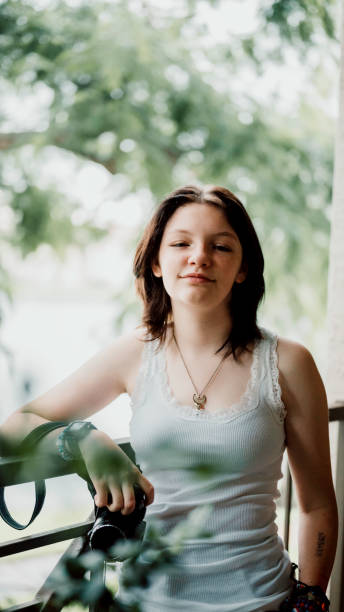 istock Transgender non-binary teenager with a camera, hobby photographer 1796769801