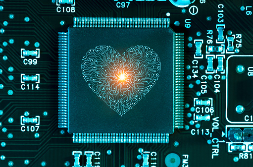 Artificial intelligence heart computer chip concept on circuit board. This file is cleaned and retouched.