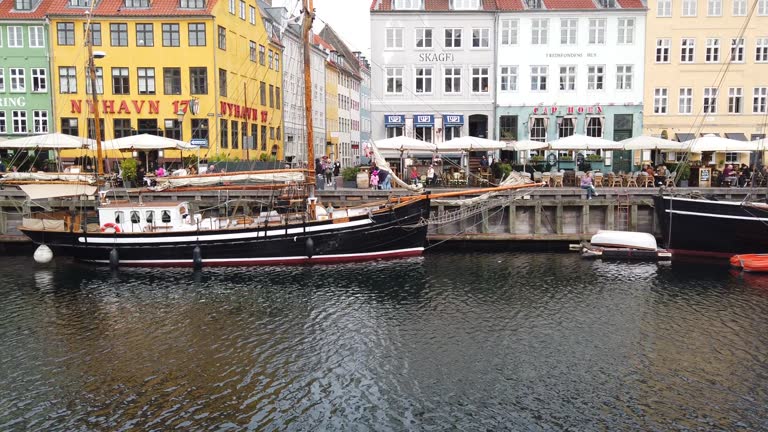 Copenhagen Nyhavn panorama city crowds of people with boats and many small colorful houses