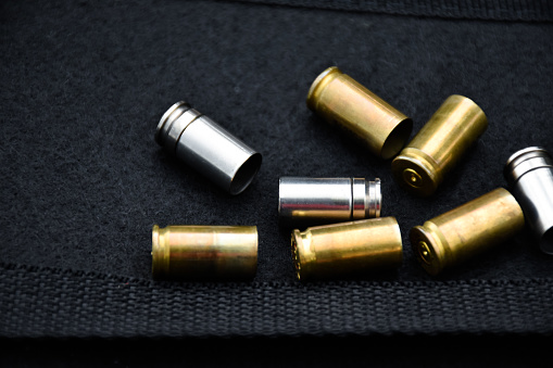 9mm pistol bullets on dark background, soft and selective focus.