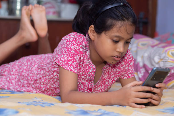 istock Child with mobile phone 1796787511