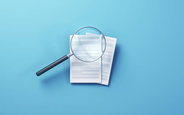 istock Documents with magnifying glass icon, sitting on Soft Blue background, Research concept 1796803360
