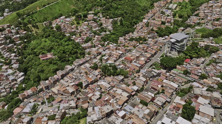Medellin Colombia Aerial v23 birds eye view drone flyover Metropolitano and Juan XXIII capturing Comuna 13 hillside residential houses and Gondola lift station - Shot with Mavic 3 Cine - November 2022