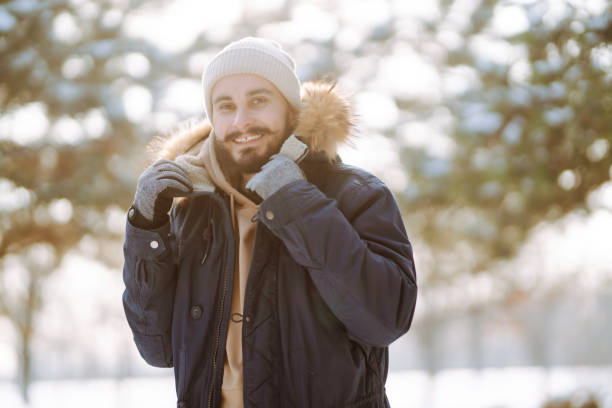 istock Cheerful man enjoying a cold snowy day. 1796820743