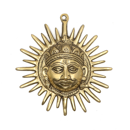 religious pendant sculpture of rays of the golden sun god king isolated in a white background