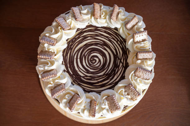 Top view of cake decorated with cookies and cream and chocolate.