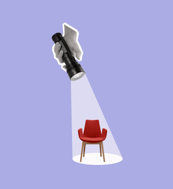 istock A hand holds a flashlight on an office chair. 1796831633