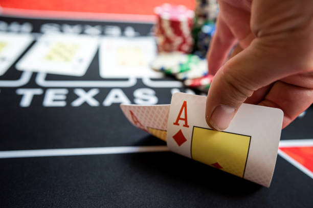 istock player is holding two ace cards - win combination at poker 1796838171