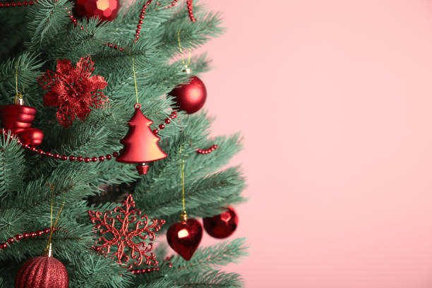 istock Christmas tree with red balls on pink background. Christmas card 1796845180