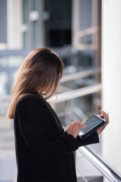 istock Typing near glassy office building. 1796859314