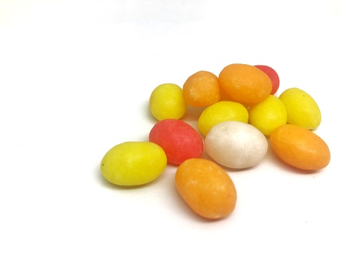 colorful round candies on white background