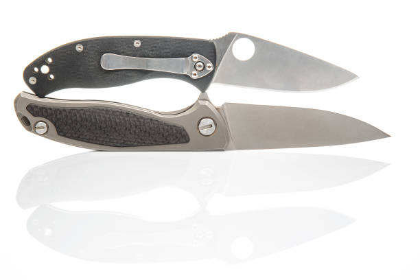 two folding knives on a white background. item for tourism and survival.