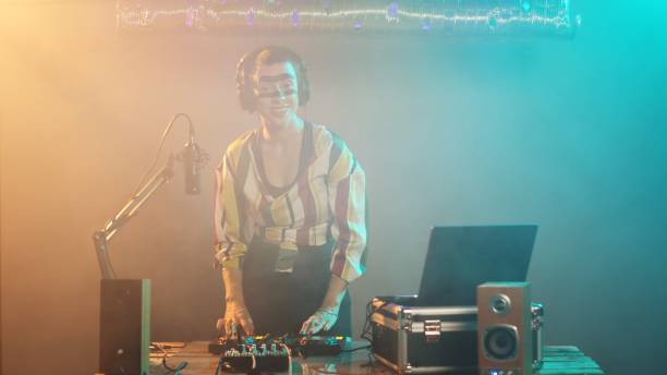 istock Female DJ playing techno music at stereo mixer 1796925024
