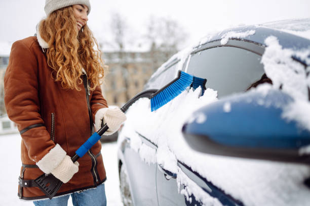 istock Cleaning snow from a car. 1796931263