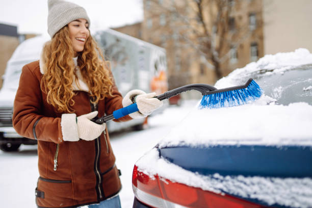 istock Cleaning snow from a car. 1796931494