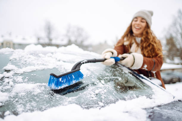 istock Cleaning snow from a car. 1796931503