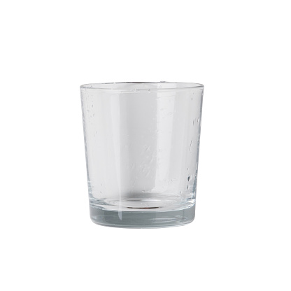 Front view of empty glass isolated on white background. Real photography of clear flat bottom glass for water or cold beverage.