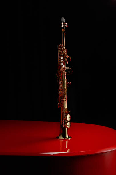 istock Saxophone on a red piano. 1796953927