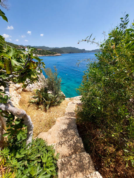 istock Staircase with small square steps leading down to the sea 1796957718