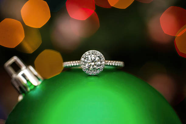istock An engagement ring on a green Christmas ornament. 1796963073