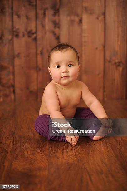 Baby Girl Sitting On Wood Floor Stock Photo - Download Image Now - Baby - Human Age, Baby Girls, Brown Hair