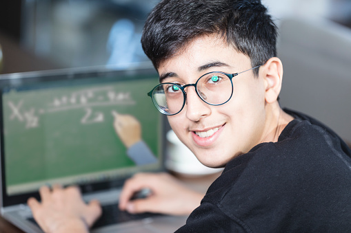 Teenager boy  having online education