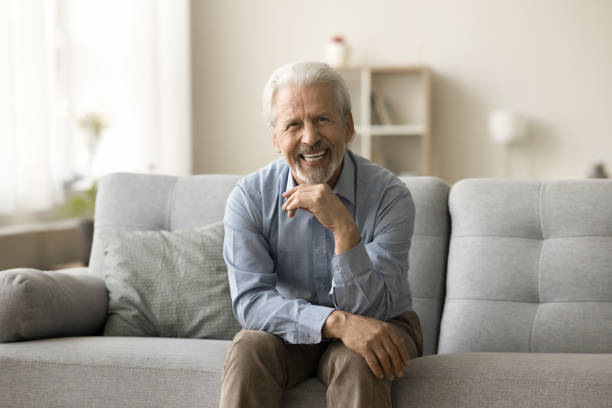 istock Happy old senior grey haired man speaking on video call 1796991522
