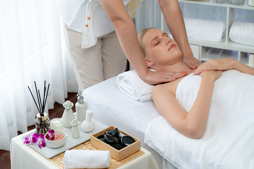 Caucasian woman customer enjoying relaxing anti-stress massage. Quiescent