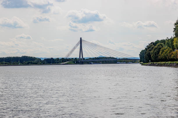 Panoramic view of Albert canal with Lanaye vehicular cable-stayed bridge in background