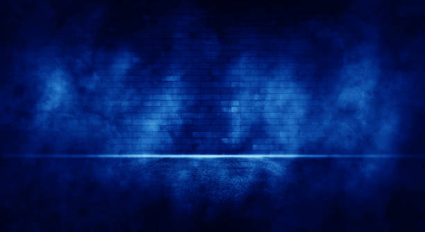 Rays neon light in the dark with smoke. Empty background scene spotlight.