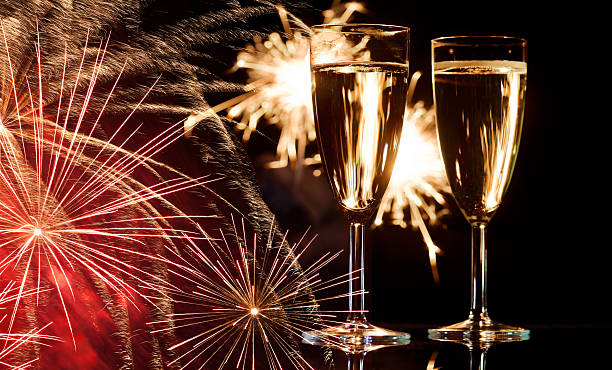 istock Champagne Glasses Infront Of Fireworks 179702593