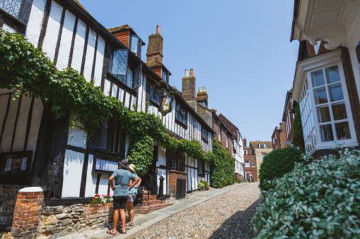 Rye, England - June 13, 2023: High St, Rye, Sussex, England. Tourists walk on the street.