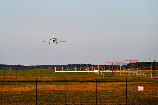 Chantilly, Virginia, USA - November 12, 2023: A private Cessna 560XL Citation XLS jet landing at Washington Dulles International Airport on short final on a sunny Fall afternoon.