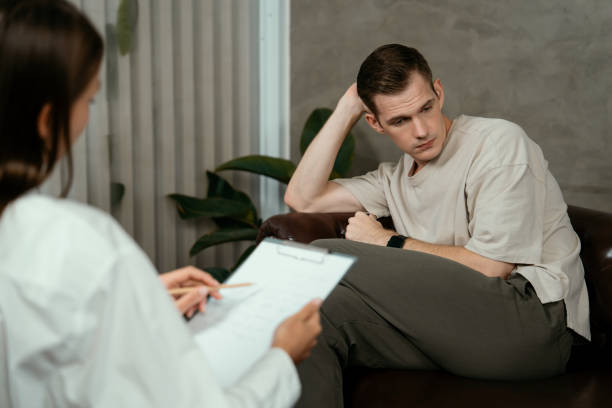 istock Stressed and depressed patient seeking help from psychiatrist. Unveiling 1797050987