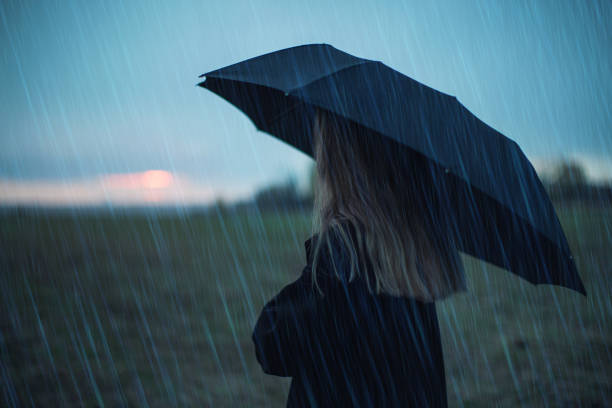 istock Woman with umbrella. Rain. Bad weather. Depression 1797069578