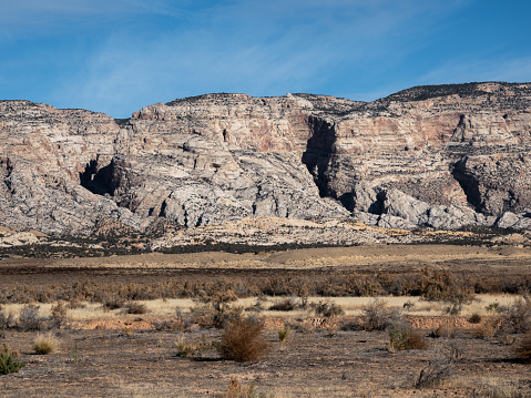 Tilted and eroded sandstone cliffs, Dinosaur National Monument, Utah.