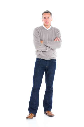 Full length image of confident mature man standing with his arms crossed on white background