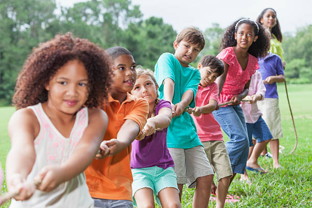 istock Children playing tug of war 179708040