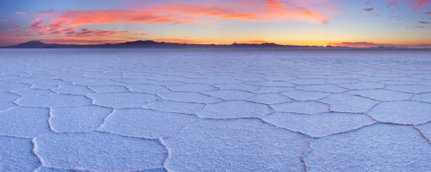 Salt flat Salar de Uyuni in Bolivia at sunrise