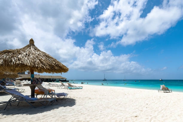 istock Chairs and Palapas on Palm Beach, Aruba 1797086947